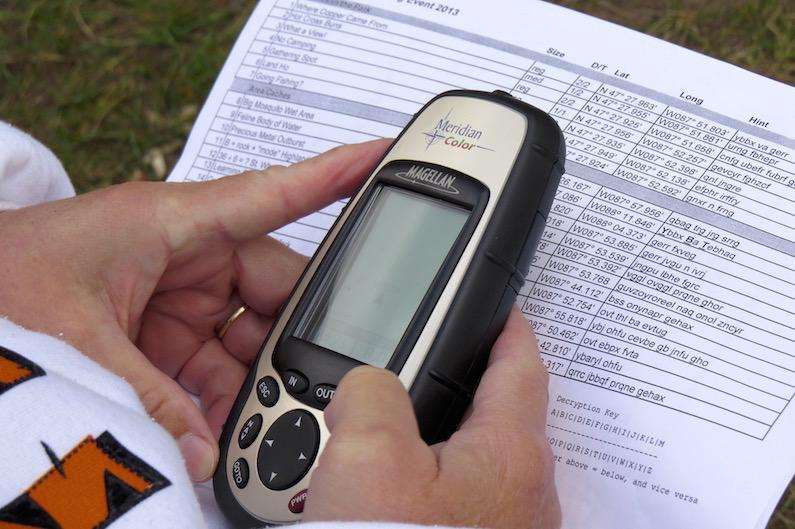 Great Hobby for RVers: Geocaching 2 Here's a Geocacher using a GPS unit to get him started by following a clue sheet. I shot this in a campground up in Copper Harbor, MI during a geocachng event that brought a bunch of RVers to the area